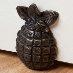 Signature Hardware Pineapple 5-1/2 in. Brass Wedge Door Stop in Antique Brass