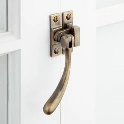 Signature Hardware Curved Brass Casement Window Latch in Antique Brass