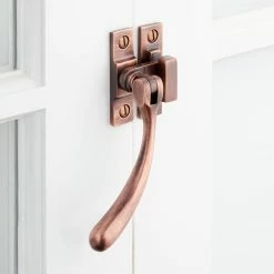 Signature Hardware Curved Brass Casement Window Latch in Antique Copper