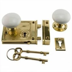 Signature Hardware Horizontal Brass Rim Lock Set with Porcelain Knobs Left Hand in Polished Brass