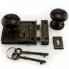 Signature Hardware Horizontal Brass Rim Lock Set with Brown Porcelain Knobs Right Hand in Antique Brass