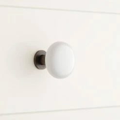 Signature Hardware Barringer 1-1/2 in. Brass Base and Ceramic Round Cabinet Knob in White with Oil Rubbed Bronze