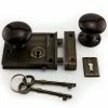 Signature Hardware Horizontal Brass Rim Lock Set with Brown Porcelain Knobs Left Hand in Antique Brass