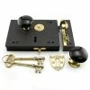 Signature Hardware Carpenter's Cast Iron Rim Lock Set with Black Porcelain Knobs Right Hand in Polished Brass